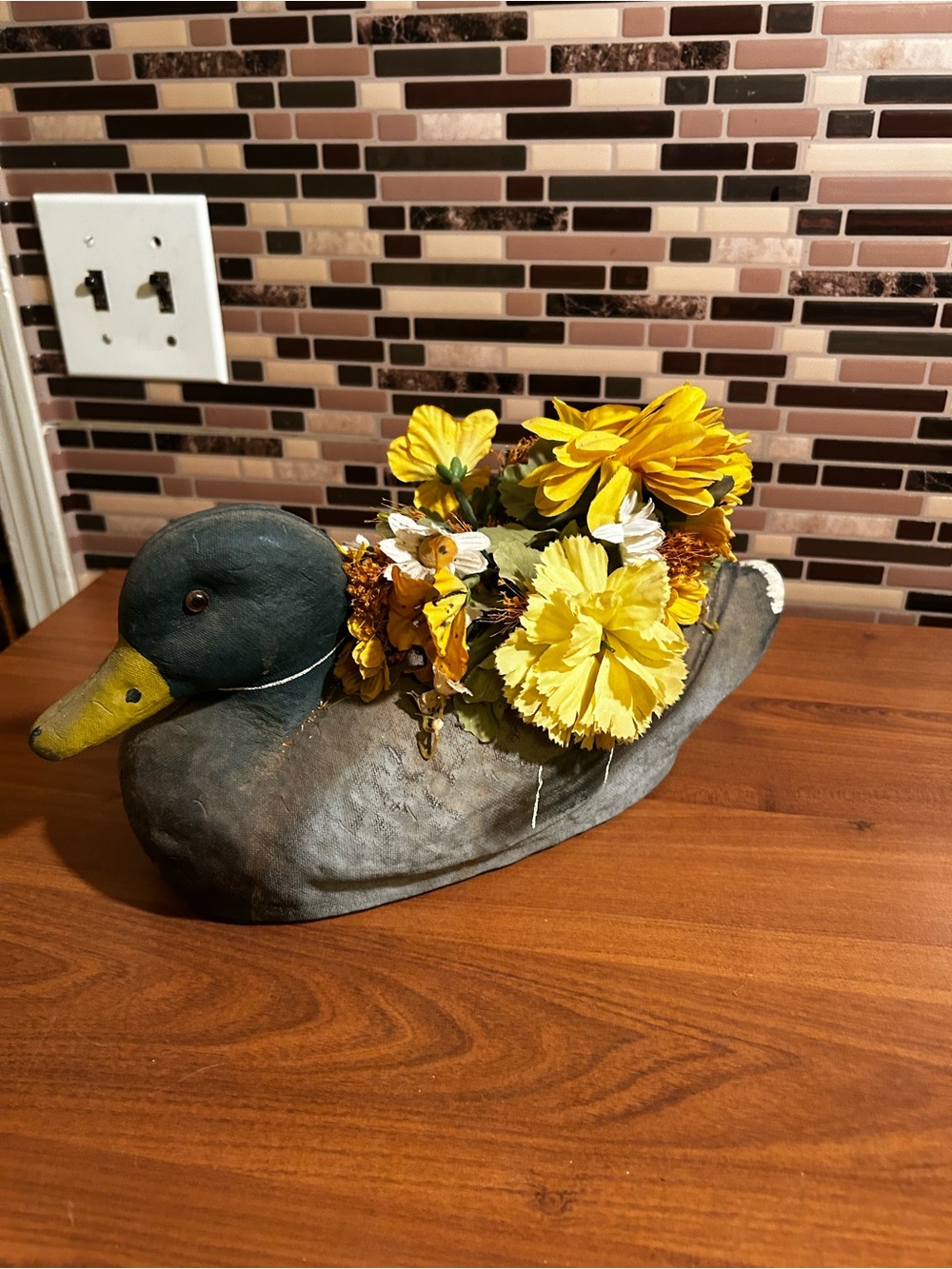 Vintage Life Like Duck Decoy Planter with Yellow Floral Arrangement
